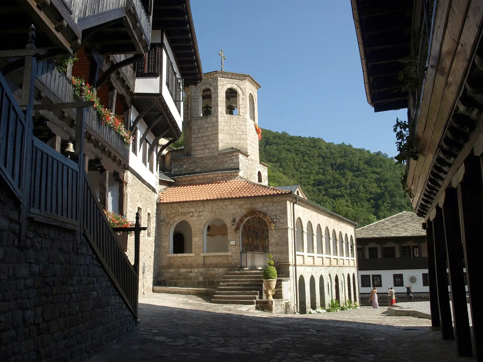 Црквата и камбанаријата на манастирот Свети Јован Бигорски, со традиционалните дрвени балкони на манастирските конаци околу дворот